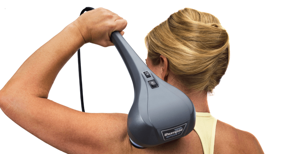 Athlete using Thumper Sport percussion massager on upper back for deep tissue
