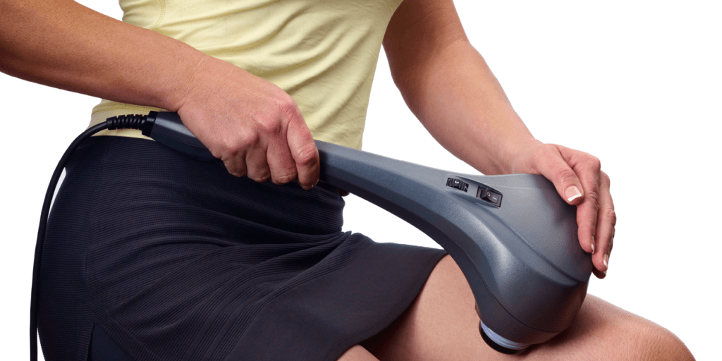 Athlete using Thumper Sport percussion massager on thighs quadriceps for deep tissue